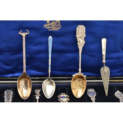 125 - A SELECTION OF EIGHTEEN SOUVENIR TEASPOONS AND A SILVER BOOKMARK, to include a blue enamel Marius Ha... 