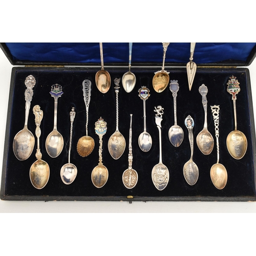 125 - A SELECTION OF EIGHTEEN SOUVENIR TEASPOONS AND A SILVER BOOKMARK, to include a blue enamel Marius Ha... 