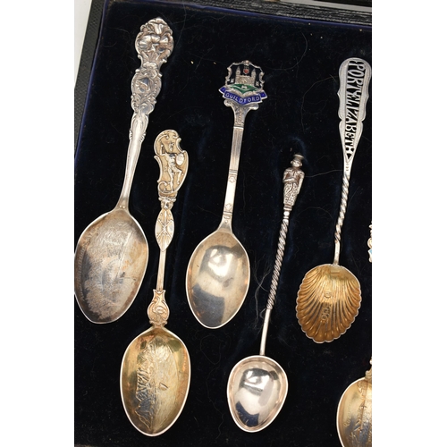 125 - A SELECTION OF EIGHTEEN SOUVENIR TEASPOONS AND A SILVER BOOKMARK, to include a blue enamel Marius Ha... 