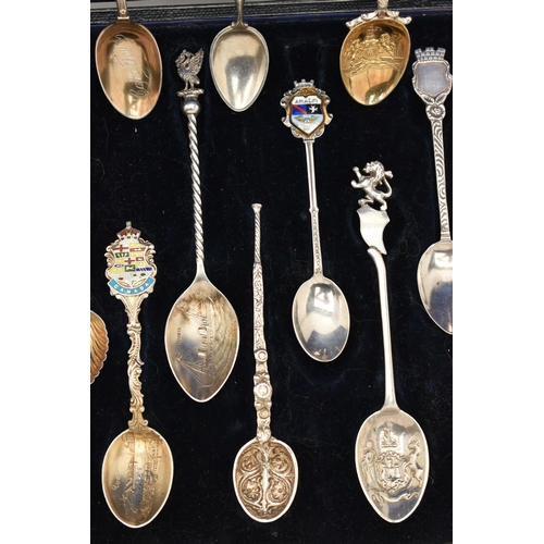 125 - A SELECTION OF EIGHTEEN SOUVENIR TEASPOONS AND A SILVER BOOKMARK, to include a blue enamel Marius Ha... 