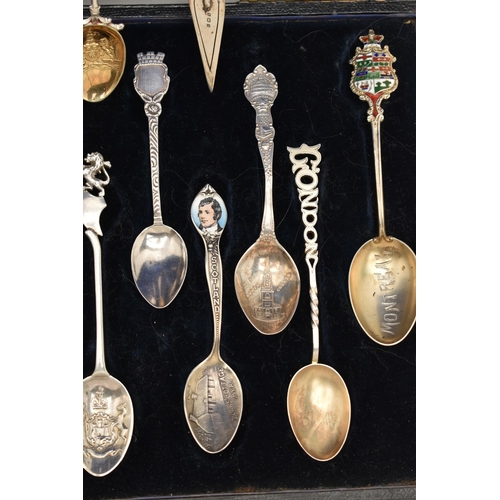 125 - A SELECTION OF EIGHTEEN SOUVENIR TEASPOONS AND A SILVER BOOKMARK, to include a blue enamel Marius Ha... 