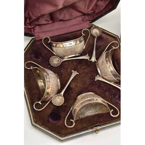 126 - A CASED SET OF FOUR SILVER OPEN SALTS, AND TWO CASED SETS OF SILVER SPOONS, the late Victorian silve... 