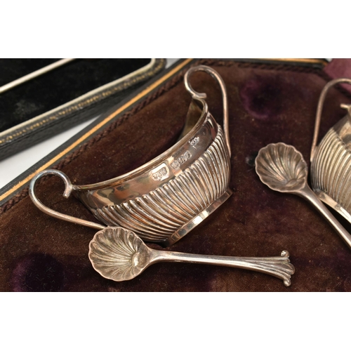 126 - A CASED SET OF FOUR SILVER OPEN SALTS, AND TWO CASED SETS OF SILVER SPOONS, the late Victorian silve... 