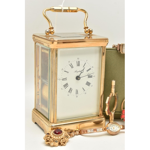 129 - A BOX OF ASSORTED ITEMS, to include a brass carriage clock, signed 'Angelus', service plaque added t... 