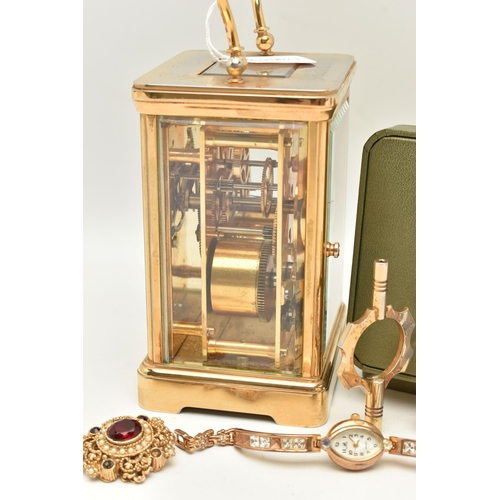 129 - A BOX OF ASSORTED ITEMS, to include a brass carriage clock, signed 'Angelus', service plaque added t... 