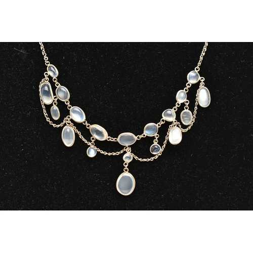 76 - A MOONSTONE FRINGE NECKLACE, designed as a series of oval moonstone cabochons, suspended from a belc... 