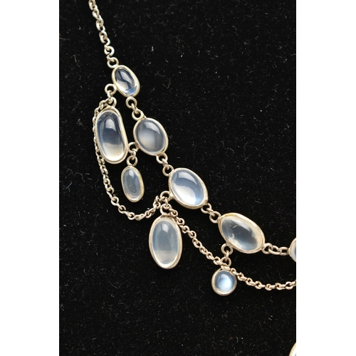 76 - A MOONSTONE FRINGE NECKLACE, designed as a series of oval moonstone cabochons, suspended from a belc... 