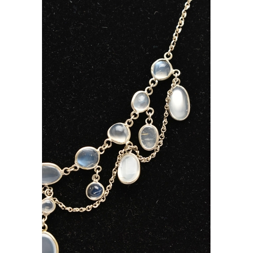 76 - A MOONSTONE FRINGE NECKLACE, designed as a series of oval moonstone cabochons, suspended from a belc... 