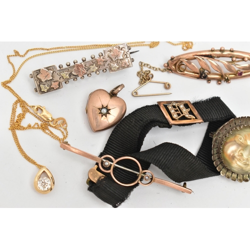 86 - AN ASSORTMENT OF LATE 19TH AND EARLY 20TH CENTURY JEWELLERY, to include a fabric bracelet with a yel... 