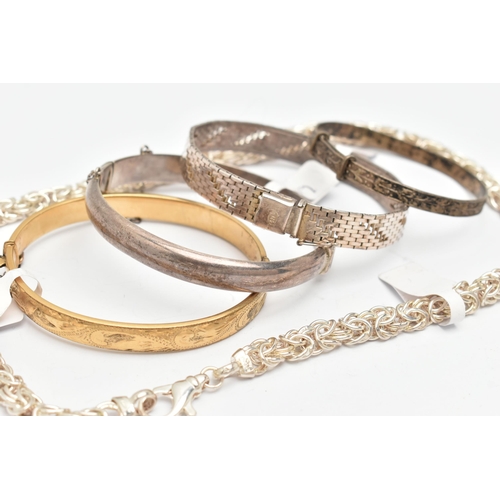 96 - FOUR BRACELETS AND A CHAIN, to include a rolled gold hinged bangle with foliate pattern, fitted with... 