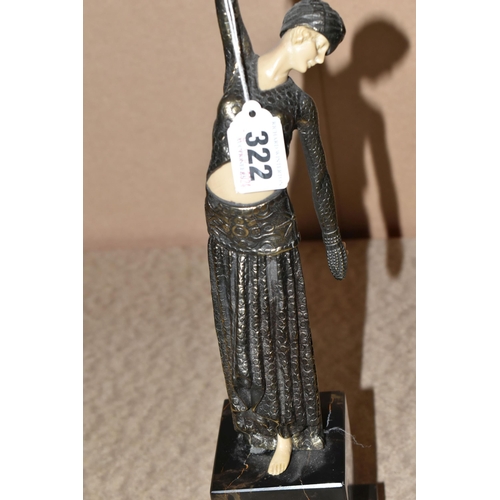 322 - AN ART DECO STYLE FIGURE, the female dancer surmounting a stepped geometric base, total height appro... 