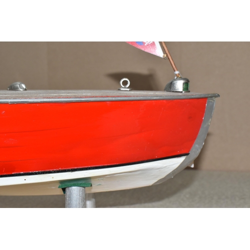 323 - A VINTAGE HANDICRAFTS 'CHRIS CRAFT' MODEL SPEED BOAT, 'Foxy Lady' fully assembled on a stand  and pa... 