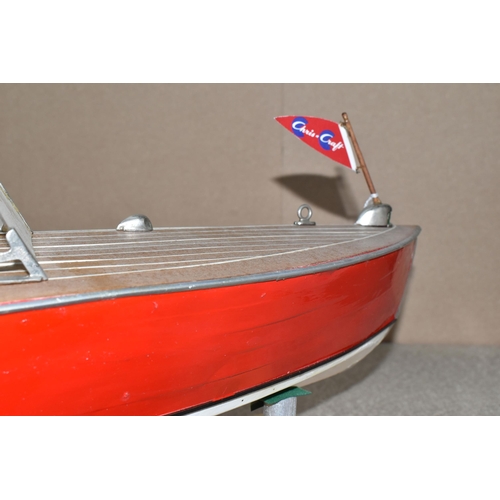 323 - A VINTAGE HANDICRAFTS 'CHRIS CRAFT' MODEL SPEED BOAT, 'Foxy Lady' fully assembled on a stand  and pa... 