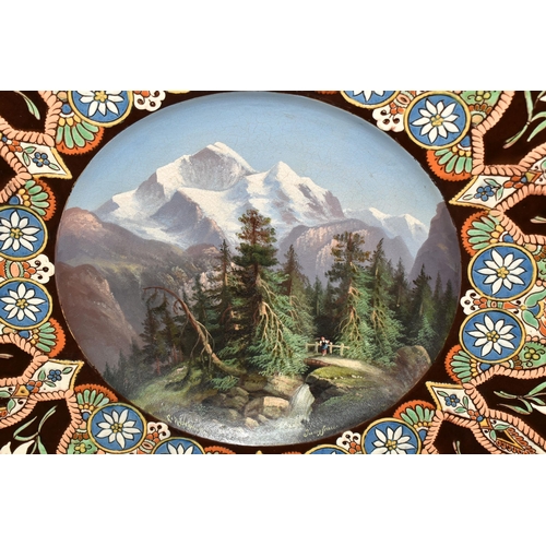 336 - A LATE 19TH CENTURY THOUNE EARTHENWARE MAJOLICA CHARGER, decorated with a hand painted Swiss alpine ... 