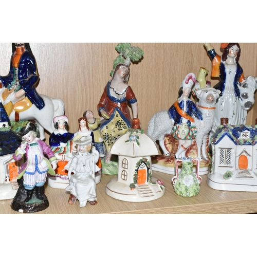 337 - A GROUP OF MAINLY STAFFORDSHIRE FIGURES AND COTTAGES, to include a flatback figure group of two figu... 