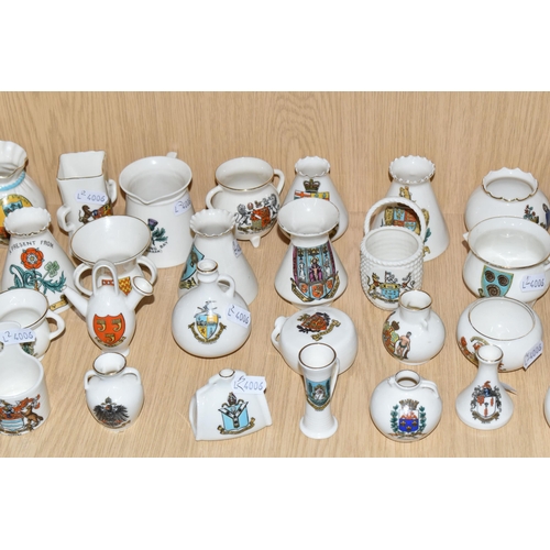 354 - A QUANTITY OF WH GOSS CRESTED WARE VESSELS, over ninety pieces, in forms to include an ancient salt ... 