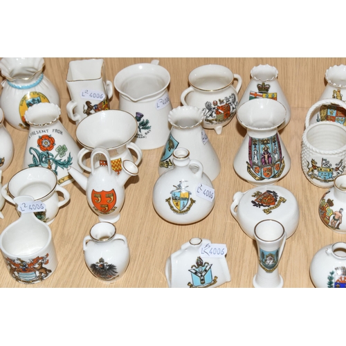 354 - A QUANTITY OF WH GOSS CRESTED WARE VESSELS, over ninety pieces, in forms to include an ancient salt ... 