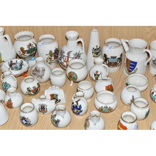 354 - A QUANTITY OF WH GOSS CRESTED WARE VESSELS, over ninety pieces, in forms to include an ancient salt ... 