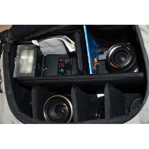 366 - AN OLYMPUS OM10 WITH LENSES IN A CARRYBAG to include a Olympus OM10 fitted with a Bell and Howell 1:... 