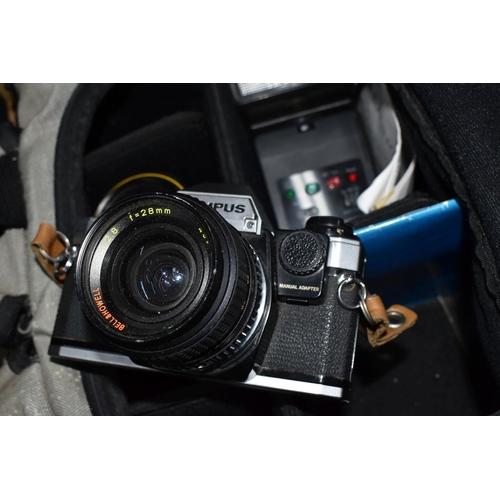 366 - AN OLYMPUS OM10 WITH LENSES IN A CARRYBAG to include a Olympus OM10 fitted with a Bell and Howell 1:... 