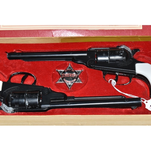 380 - A BOXED B.C.M. OUTLAW GUNS SET, comprising a pair of replica Remington Apache calibre .44 cap firing... 