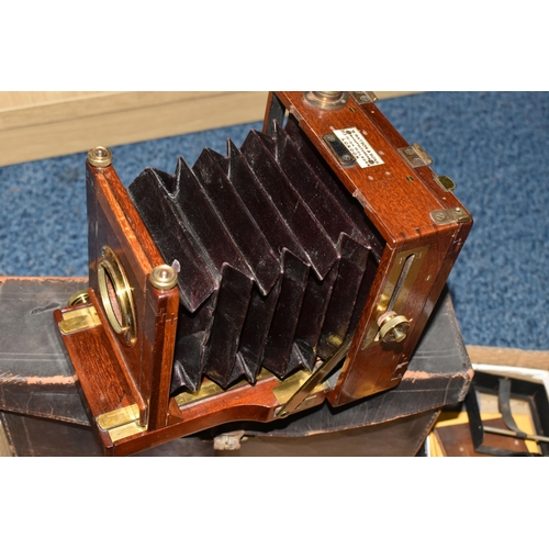 434 - A MAHOGANY QUARTER PLATE CAMERA BY W. WATSON AND SONS, with brass fittings, lens board but no lens, ... 