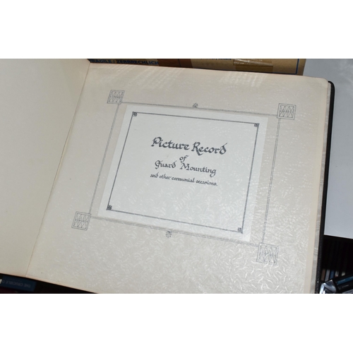 438 - A Photograph Album from The Household Division and inscribed 'Septem Juncta In Umo' comprising eight... 