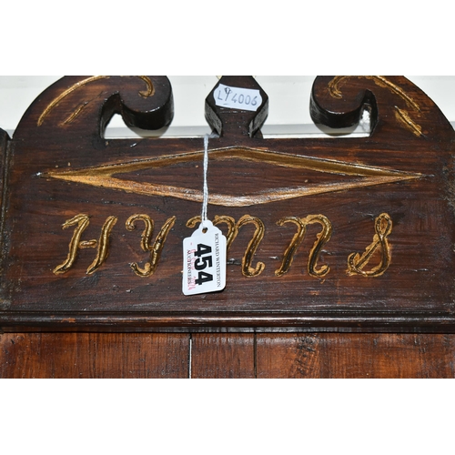 454 - A CARVED WOOD CHURCH HYMN BOARD, possibly 19th century, five shelves, carved decoration is painted i... 