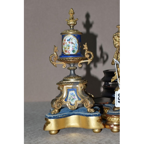 460 - AN ANTIQUE FRENCH GILT METAL MANTEL CLOCK AND GARNITURE SET, the mantel clock has a hand painted por... 