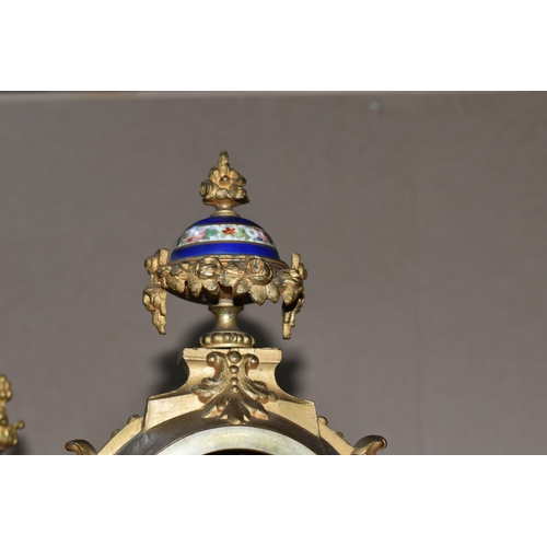 460 - AN ANTIQUE FRENCH GILT METAL MANTEL CLOCK AND GARNITURE SET, the mantel clock has a hand painted por... 