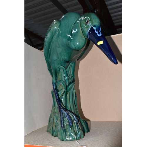 461 - LARGE CERAMIC HERON, pottery study of a heron in a natural setting of reeds, in stooped pose finishe... 