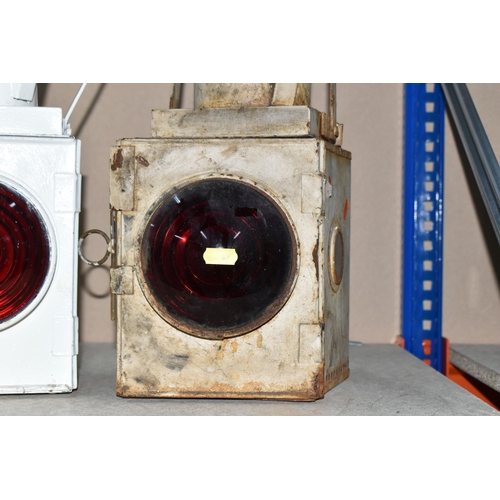 473 - TWO RAILWAY TAIL LAMPS, one marked B.R. (M), has been repainted and is complete with burner and refl... 