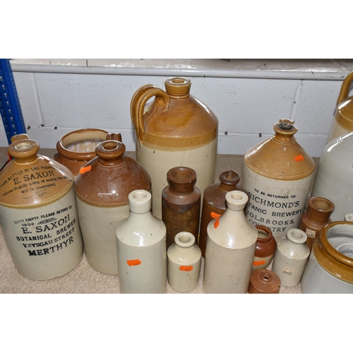 527 - A GROUP OF STONEWARE BREWERIANA comprising assorted printed and plain bottles of varying sizes to in... 