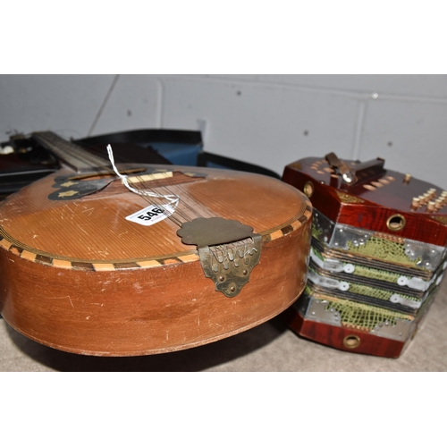 546 - A GROUP OF MUSICAL INSTRUMENTS, comprising a flat back Mandolin (Mandola), length 63cm, a Concertina... 