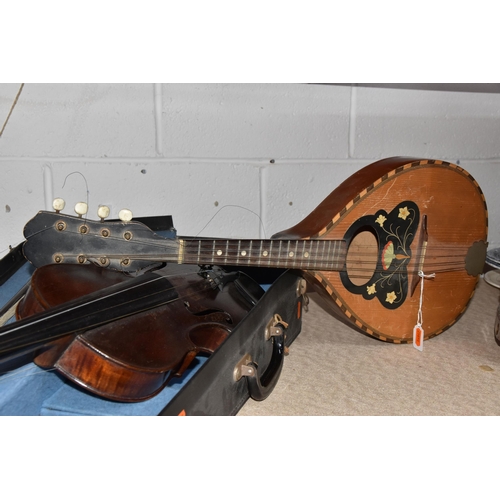 546 - A GROUP OF MUSICAL INSTRUMENTS, comprising a flat back Mandolin (Mandola), length 63cm, a Concertina... 