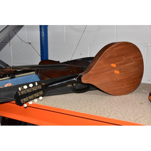 546 - A GROUP OF MUSICAL INSTRUMENTS, comprising a flat back Mandolin (Mandola), length 63cm, a Concertina... 