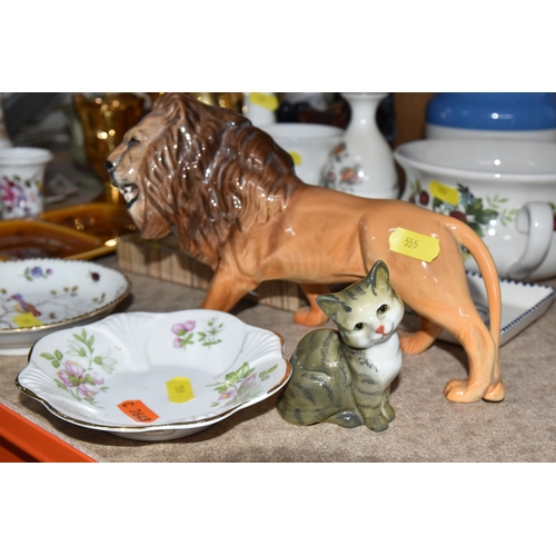 555 - A GROUP OF NAMED ORNAMENTAL CERAMICS, to include a Beswick lion and cat figurine, Royal Crafton trin... 