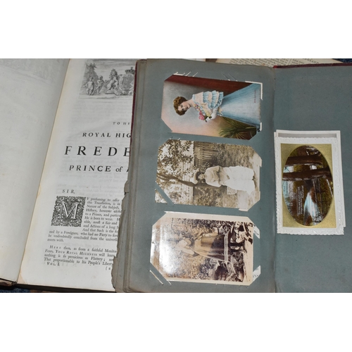 570 - TWO ANTIQUARIAN BOOKS AND AN ALBUM OF POSTCARDS, comprising an album of one hundred and forty five l... 