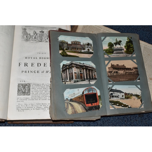 570 - TWO ANTIQUARIAN BOOKS AND AN ALBUM OF POSTCARDS, comprising an album of one hundred and forty five l... 