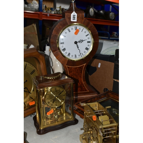 585 - A GROUP OF CLOCKS, comprising a modern large mantel clock, height 50cm, a Kienzle wall clock with ce... 