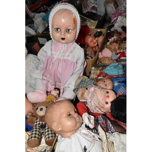 588 - FIVE BOXES AND LOOSE DOLLS, to include composition, cloth, knitted and plastic dolls, souvenir dolls... 