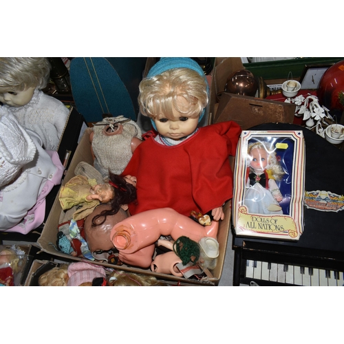 588 - FIVE BOXES AND LOOSE DOLLS, to include composition, cloth, knitted and plastic dolls, souvenir dolls... 