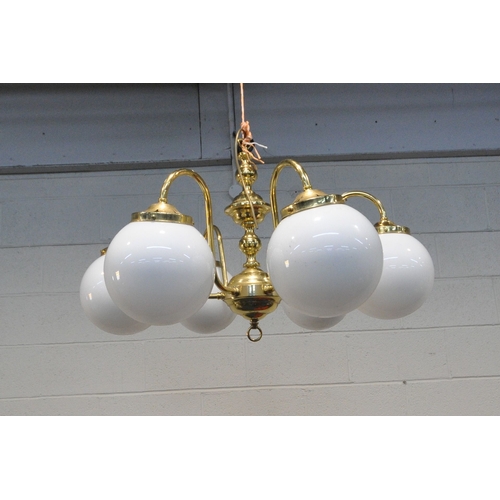 1324 - A BRASS SIX BRANCH CHANDELIER, with globe glass shades, approximate diameter 76cm x approximate heig... 