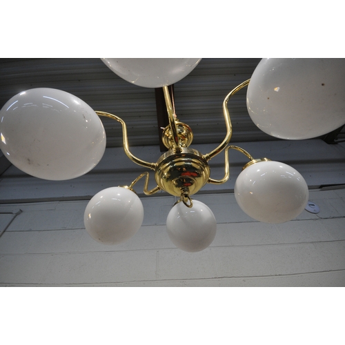 1324 - A BRASS SIX BRANCH CHANDELIER, with globe glass shades, approximate diameter 76cm x approximate heig... 