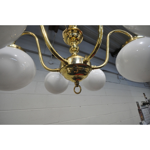 1324 - A BRASS SIX BRANCH CHANDELIER, with globe glass shades, approximate diameter 76cm x approximate heig... 