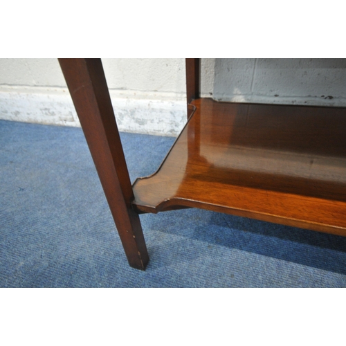 1202 - A REPRODUCTION MAHOGANY COFFEE TABLE, with a wavy raised gallery, raised on square legs, united by a... 