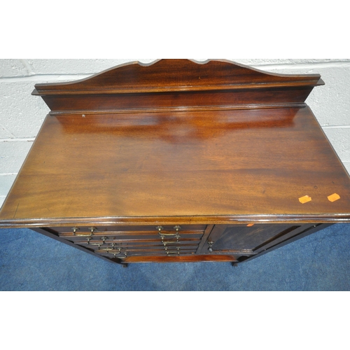 1205 - AN EARLY 20TH CENTURY MAHOGANY MUSIC CABINET, with five drawers and a single cupboard door, a wavy a... 