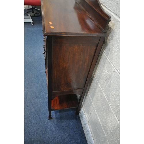 1205 - AN EARLY 20TH CENTURY MAHOGANY MUSIC CABINET, with five drawers and a single cupboard door, a wavy a... 