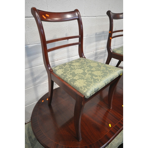 1208 - A REPRODUCTION MAHOGANY OVAL EXTENDING DINING TABLE, with one additional leaf, raised on four shaped... 