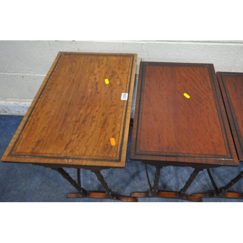 1209 - A REPRODUCTION MAHOGANY QUARTETTO NEST OF FOUR TABLES, raised on turned legs, shaped feet, united by... 